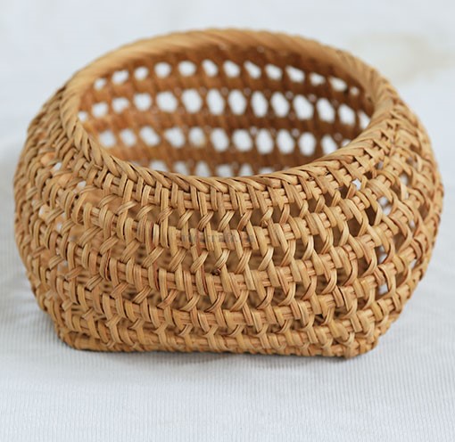 Woven rattan and fern basket